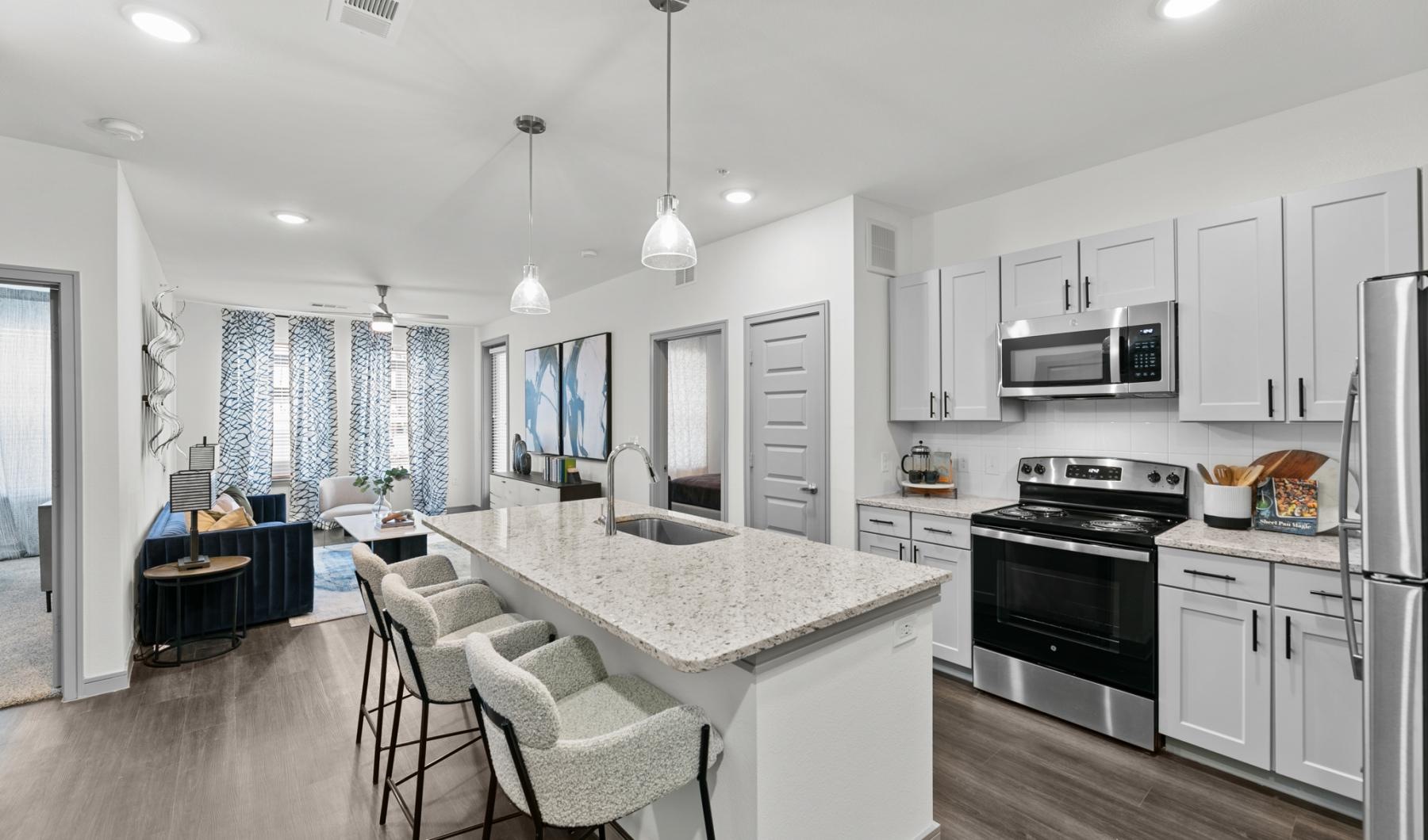 a kitchen with white cabinets