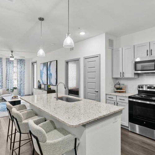 a kitchen with white cabinets