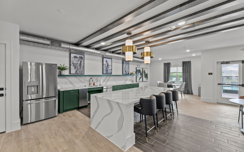 a living room with a large tv and couches